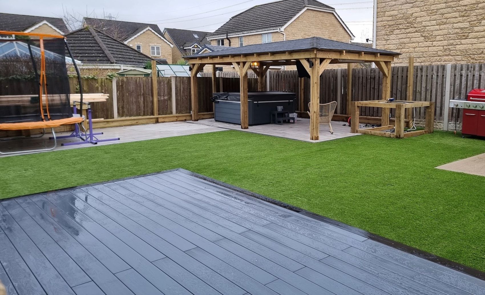 Family garden lawn with patio and play space