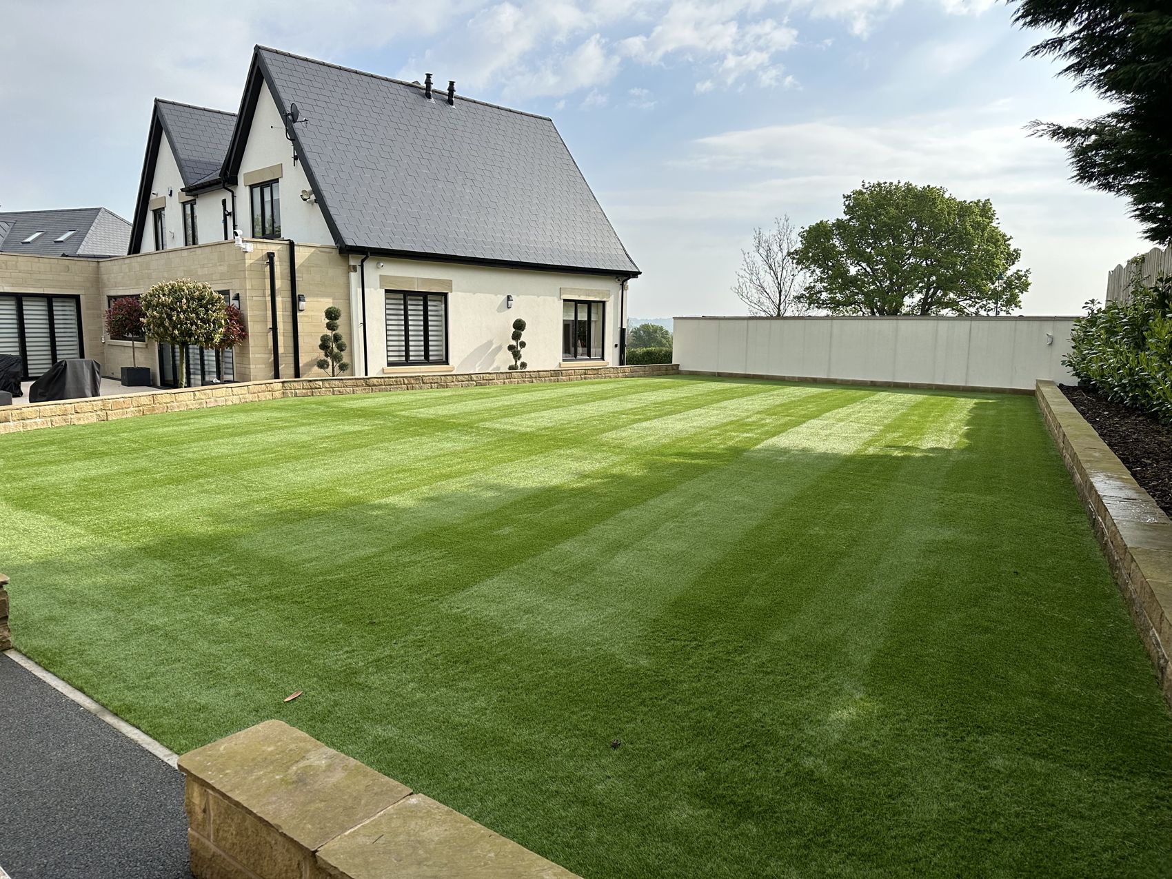 Finished striped artificial lawn