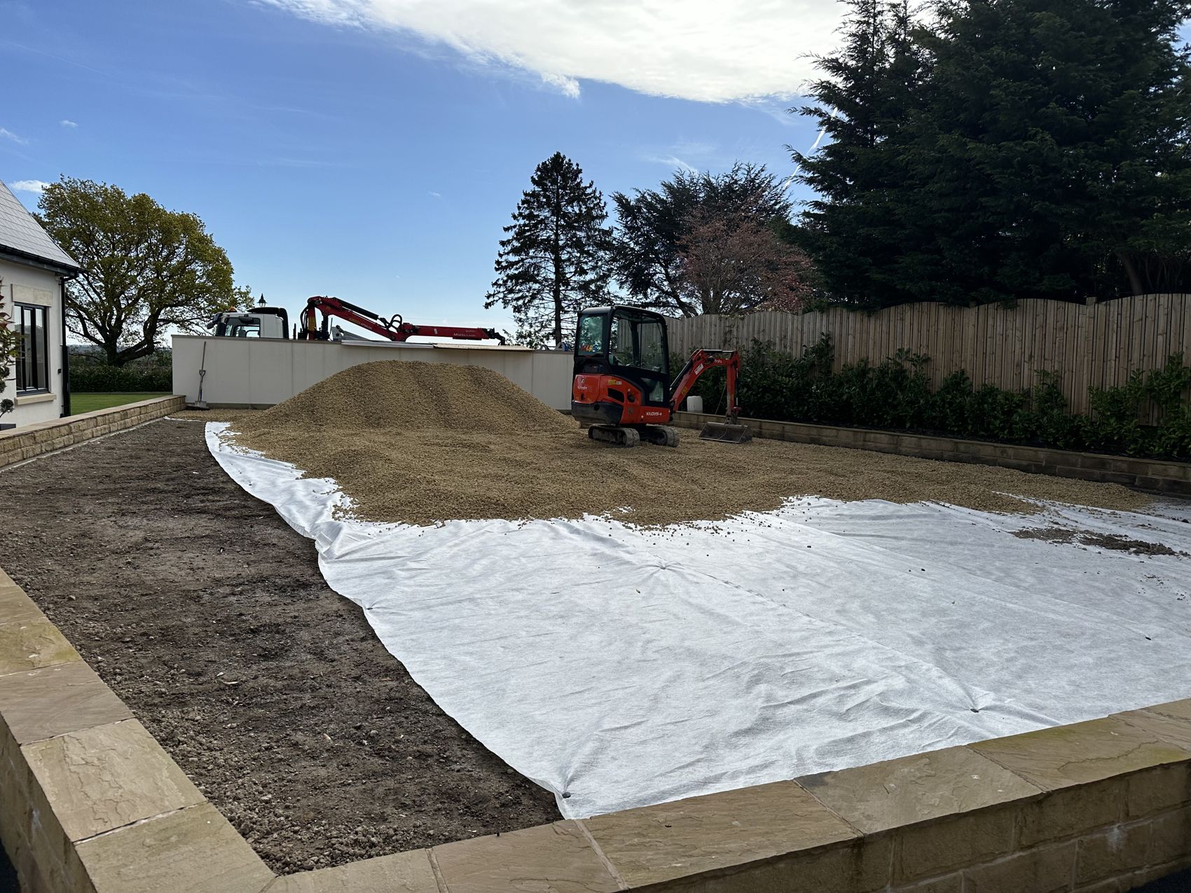Weed membrane and compacted free-draining sub-base laid